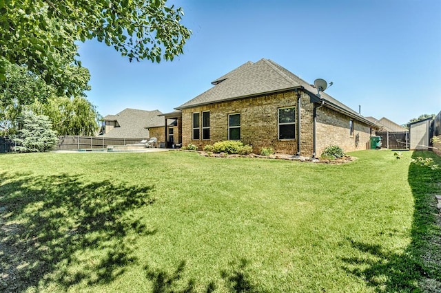 19633 Stratmore Way, Edmond, OK 73012 - rear view of property featuring brick siding and a shingled roof