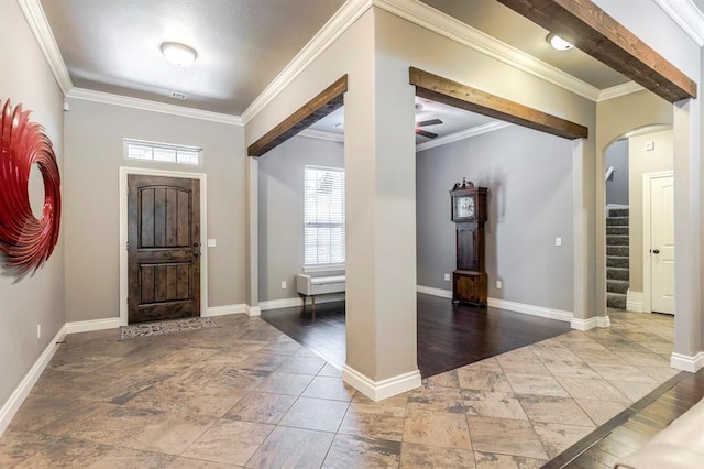 19633 Stratmore Way, Edmond, OK 73012 - entryway featuring arched walkways, a ceiling fan, ornamental molding, stairway, and baseboards