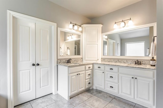19633 Stratmore Way, Edmond, OK 73012 - bathroom with double vanity and tile patterned flooring