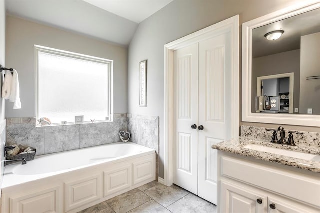 19633 Stratmore Way, Edmond, OK 73012 - full bathroom with a bath, vanity, tile patterned flooring, and vaulted ceiling
