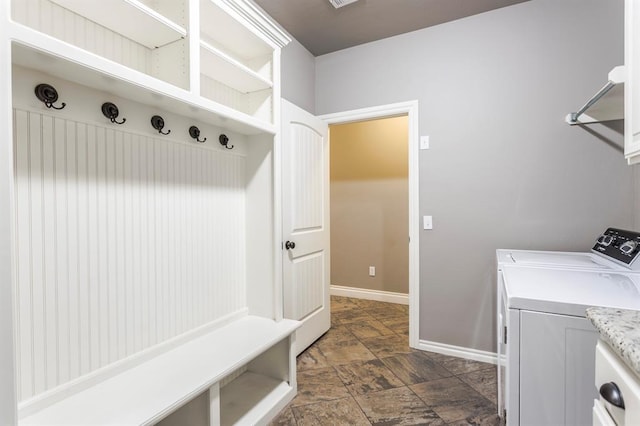 19633 Stratmore Way, Edmond, OK 73012 - washroom featuring dark stone finish flooring, separate washer and dryer, and baseboards