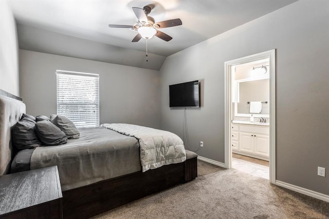 19633 Stratmore Way, Edmond, OK 73012 - bedroom featuring light carpet, baseboards, lofted ceiling, connected bathroom, and a ceiling fan