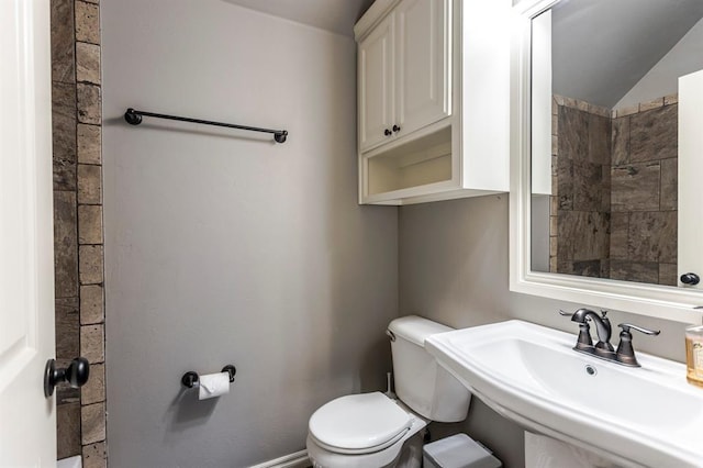 19633 Stratmore Way, Edmond, OK 73012 - bathroom featuring toilet, a sink, and a shower