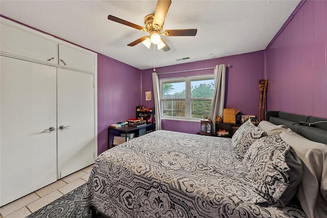 5505 S Villa Ave, Oklahoma City, OK 73119 - bedroom featuring light tile patterned floors, ceiling fan, and a textured ceiling