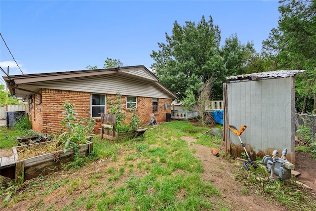 5505 S Villa Ave, Oklahoma City, OK 73119 - view of yard with a garden and a shed