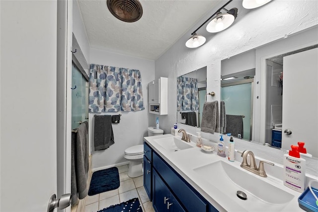 5505 S Villa Ave, Oklahoma City, OK 73119 - bathroom featuring double vanity, tile patterned flooring, a shower stall, and a textured ceiling