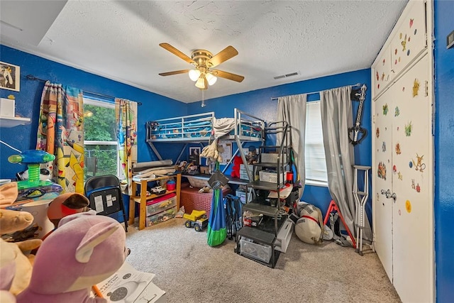 5505 S Villa Ave, Oklahoma City, OK 73119 - bedroom featuring carpet flooring, a textured ceiling, and a ceiling fan