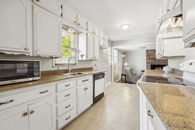 2600 NW 34th St, Oklahoma City, OK 731 - kitchen with white appliances, a sink, white cabinetry, and healthy amount of natural light