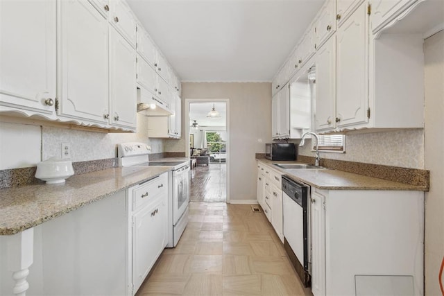 2600 NW 34th St, Oklahoma City, OK 731 - kitchen with white appliances, a sink, white cabinetry, and backsplash