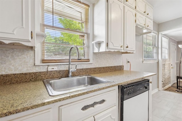2600 NW 34th St, Oklahoma City, OK 731 - kitchen with dishwasher, a sink, white cabinets, and decorative backsplash