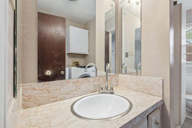 2600 NW 34th St, Oklahoma City, OK 731 - bathroom featuring washer / clothes dryer, toilet, and vanity