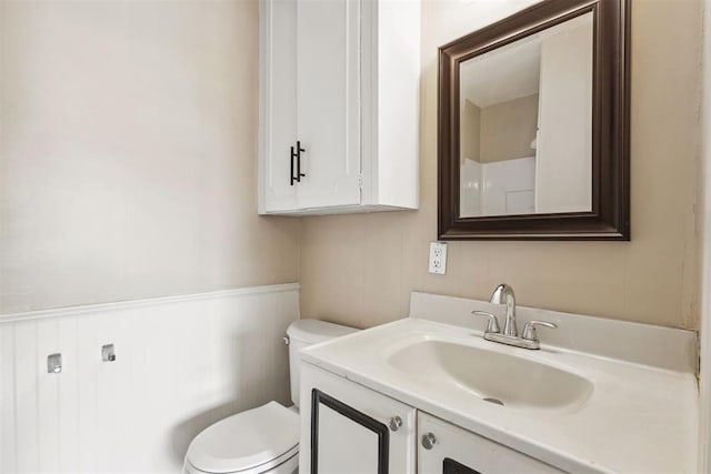 2600 NW 34th St, Oklahoma City, OK 731 - bathroom featuring toilet, vanity, and wainscoting