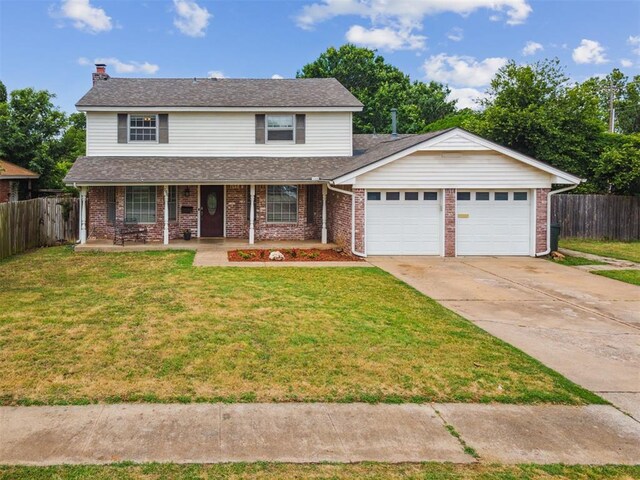 700 Nancy Lynn Ter, Norman, OK 73069 - traditional-style house featuring a garage, brick siding, concrete driveway, and a porch