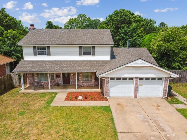 700 Nancy Lynn Ter, Norman, OK 73069 - traditional-style house featuring brick siding, concrete driveway, a garage, and covered porch