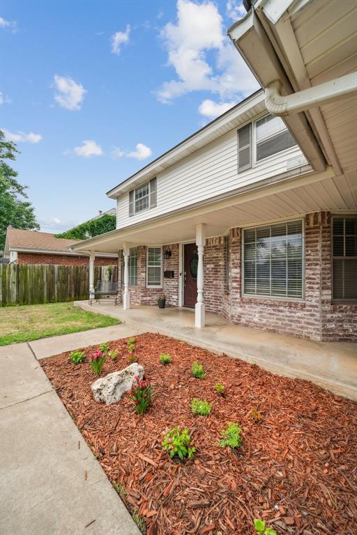 700 Nancy Lynn Ter, Norman, OK 73069 - view of front facade featuring brick siding and a porch