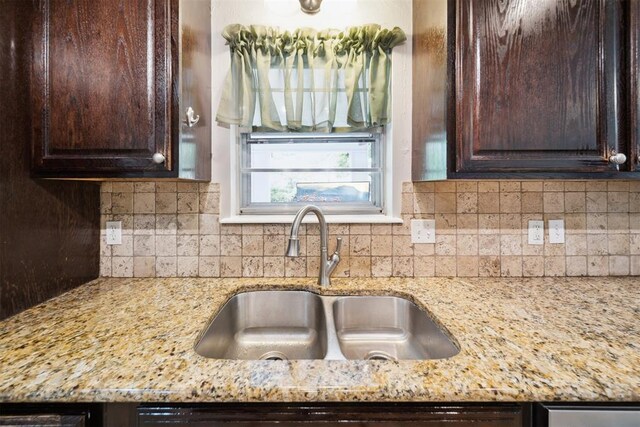 700 Nancy Lynn Ter, Norman, OK 73069 - kitchen featuring a sink, dark brown cabinetry, and light stone countertops