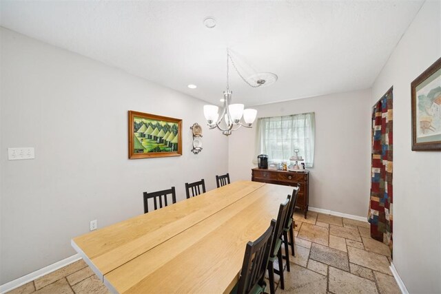 700 Nancy Lynn Ter, Norman, OK 73069 - dining room featuring stone tile floors, a chandelier, recessed lighting, and baseboards