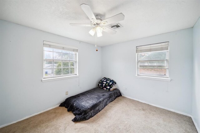 700 Nancy Lynn Ter, Norman, OK 73069 - carpeted bedroom with baseboards and a ceiling fan