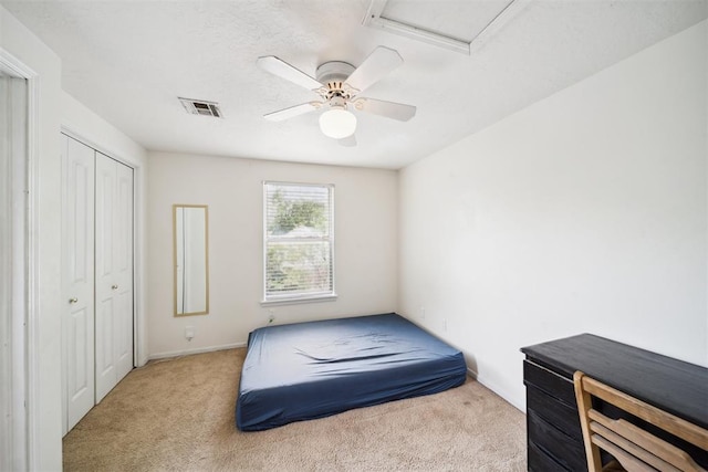 700 Nancy Lynn Ter, Norman, OK 73069 - bedroom with carpet floors, attic access, a closet, and a ceiling fan