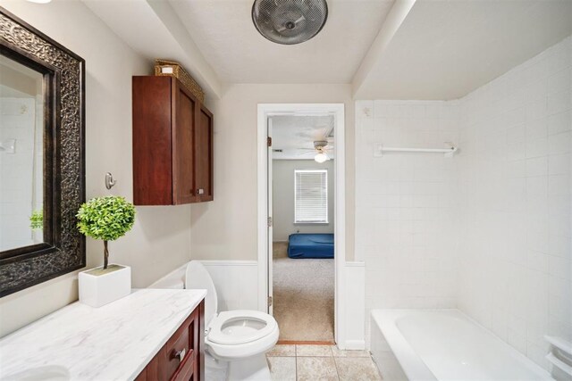 700 Nancy Lynn Ter, Norman, OK 73069 - bathroom with vanity, toilet, ceiling fan, tub / shower combination, and tile patterned flooring