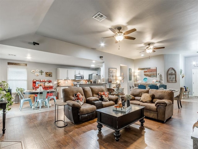 419 NE 23rd Ter, Newcastle, OK 73065 - living room with a ceiling fan, light wood-style floors, and vaulted ceiling