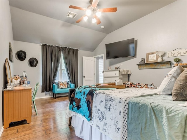 419 NE 23rd Ter, Newcastle, OK 73065 - bedroom with lofted ceiling, hardwood / wood-style flooring, baseboards, and ceiling fan