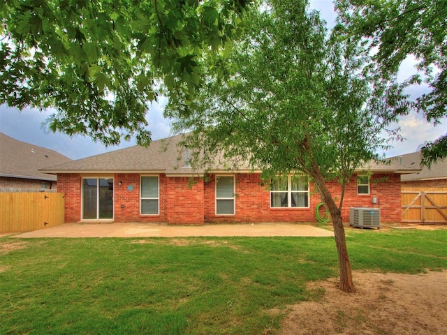 419 NE 23rd Ter, Newcastle, OK 73065 - rear view of house featuring a patio, central AC, and brick siding