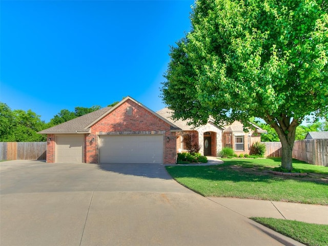 view of front of property with brick siding, concrete driveway, and a garage