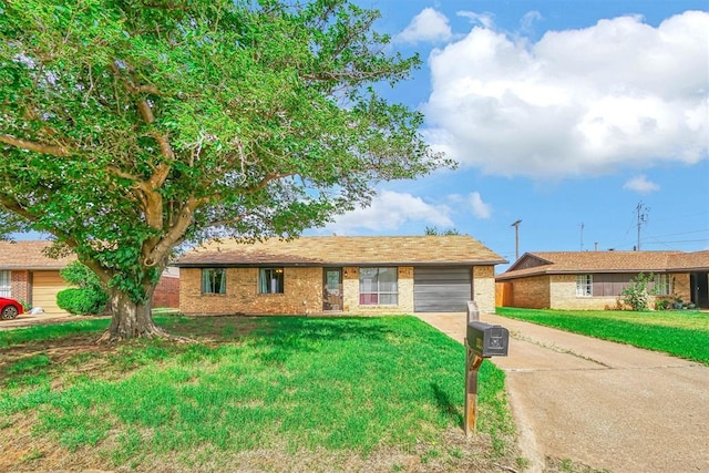 1904 Gemini St, Altus, OK 73521 - single story home featuring an attached garage, concrete driveway, brick siding, and a front lawn