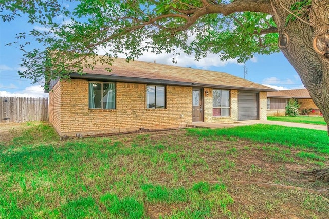 1904 Gemini St, Altus, OK 73521 - ranch-style house featuring brick siding, an attached garage, a shingled roof, and driveway