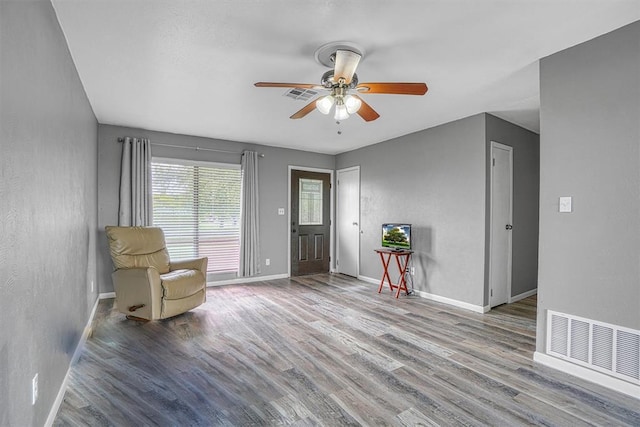 1904 Gemini St, Altus, OK 73521 - sitting room featuring wood finished floors, a ceiling fan, and baseboards