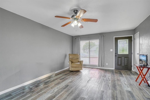1904 Gemini St, Altus, OK 73521 - unfurnished room featuring wood finished floors, a ceiling fan, and baseboards
