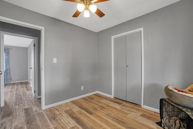 1904 Gemini St, Altus, OK 73521 - bedroom featuring light wood-style flooring, baseboards, and ceiling fan