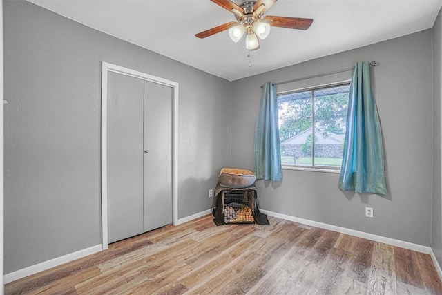 1904 Gemini St, Altus, OK 73521 - bedroom featuring wood finished floors, baseboards, a ceiling fan, and a closet