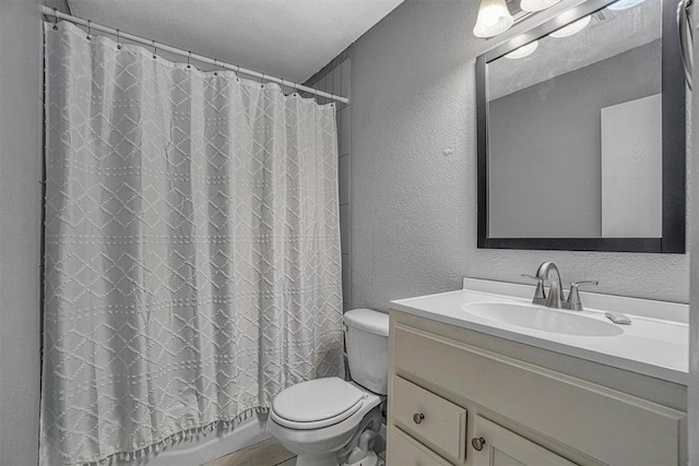 1904 Gemini St, Altus, OK 73521 - bathroom featuring a textured wall, vanity, toilet, and curtained shower