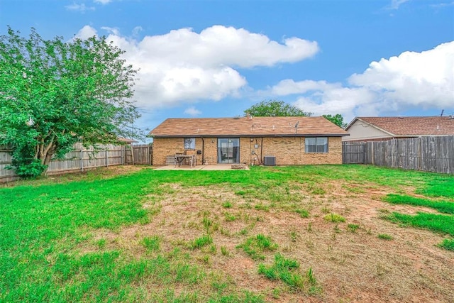 1904 Gemini St, Altus, OK 73521 - rear view of house with a patio area, brick siding, and central air condition unit