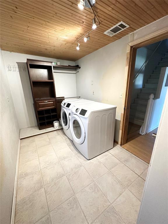 1024 Zinn Ave, Blair, OK 73526 - washroom featuring washer and dryer, rail lighting, wooden ceiling, and light tile patterned floors