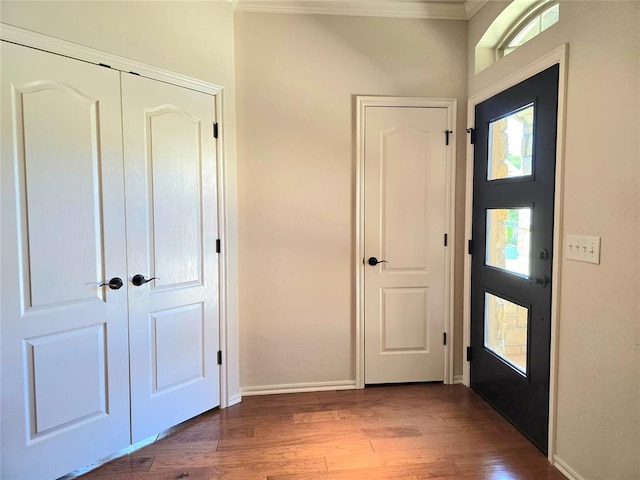 5608 NW 127th St, Oklahoma City, OK 73142 - foyer entrance featuring crown molding, wood finished floors, and baseboards
