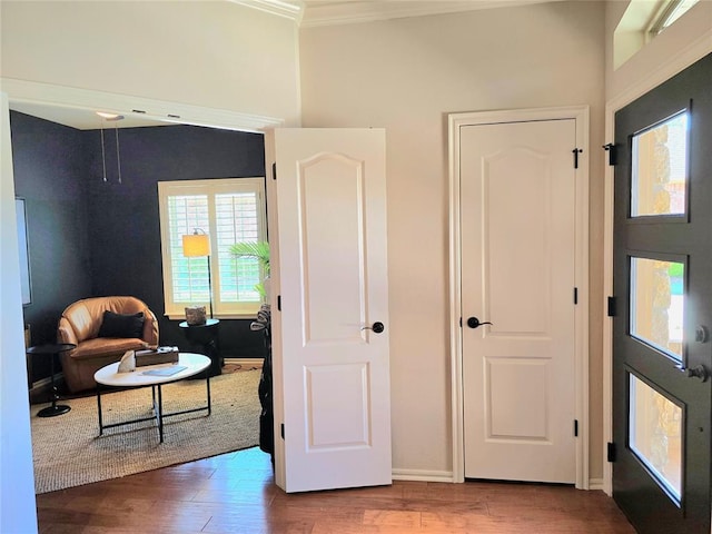 5608 NW 127th St, Oklahoma City, OK 73142 - entrance foyer with wood finished floors, crown molding, baseboards, and a high ceiling