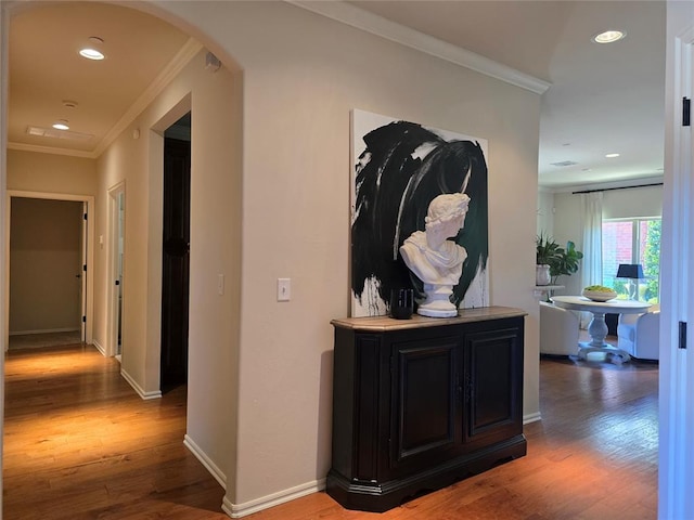5608 NW 127th St, Oklahoma City, OK 73142 - corridor featuring crown molding, light wood finished floors, arched walkways, recessed lighting, and baseboards