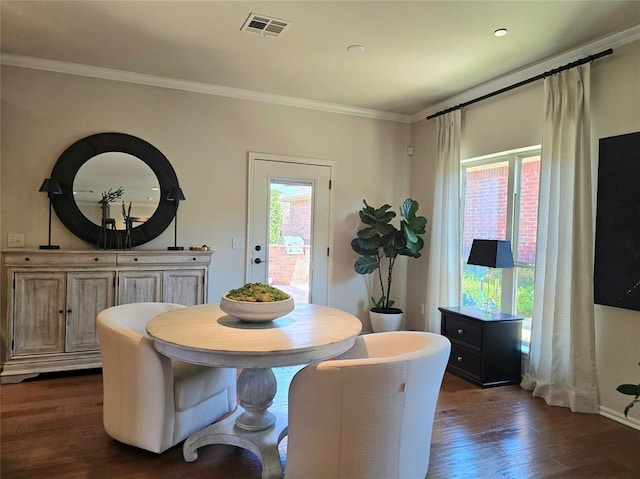 5608 NW 127th St, Oklahoma City, OK 73142 - dining space featuring dark wood-style flooring and ornamental molding