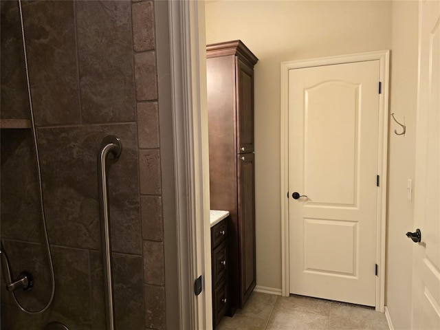 5608 NW 127th St, Oklahoma City, OK 73142 - full bath featuring tiled shower, tile patterned floors, vanity, and baseboards
