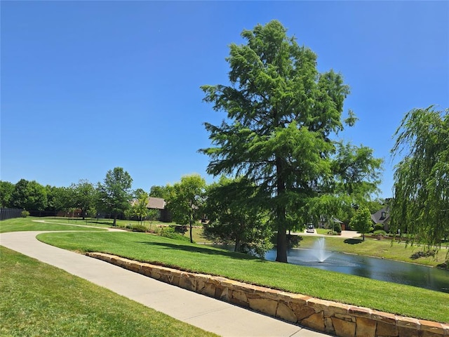5608 NW 127th St, Oklahoma City, OK 73142 - surrounding community with a yard and a water view