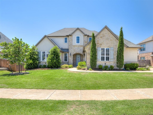 832 Gateway Bridge Rd, Edmond, OK 73034 - french country inspired facade featuring stone siding and stucco siding