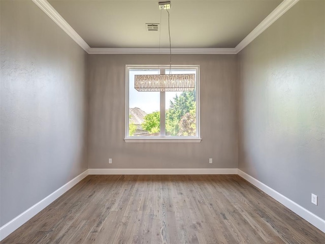 832 Gateway Bridge Rd, Edmond, OK 73034 - spare room with crown molding, baseboards, wood finished floors, and a chandelier