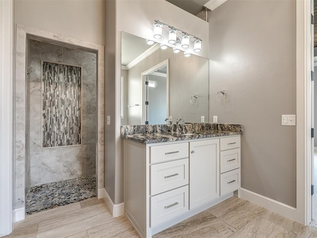 832 Gateway Bridge Rd, Edmond, OK 73034 - full bathroom with ornamental molding, walk in shower, vanity, and baseboards