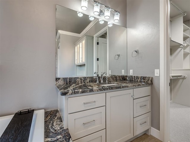 832 Gateway Bridge Rd, Edmond, OK 73034 - bathroom with vanity and a walk in closet