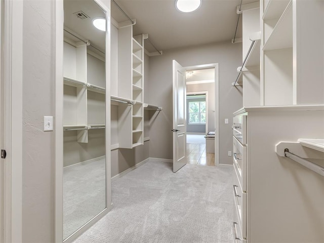 832 Gateway Bridge Rd, Edmond, OK 73034 - walk in closet featuring light colored carpet