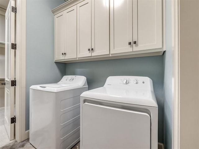 832 Gateway Bridge Rd, Edmond, OK 73034 - laundry room featuring washing machine and clothes dryer and cabinet space