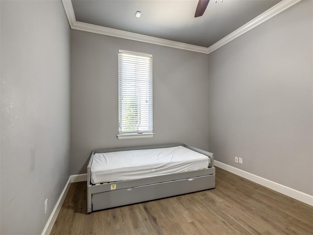 832 Gateway Bridge Rd, Edmond, OK 73034 - bedroom featuring ornamental molding, baseboards, wood finished floors, and a ceiling fan